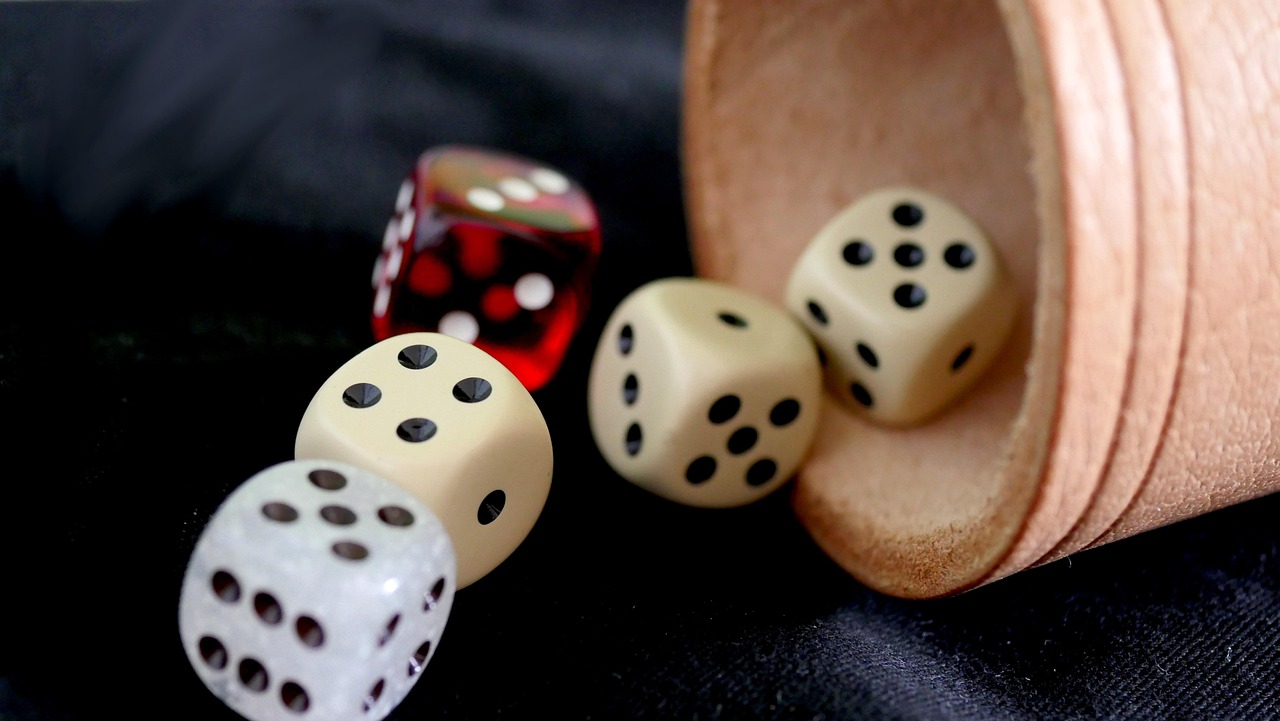 Are there advantages to momentum-based dice strategies?